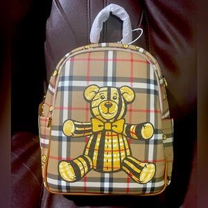 Plaid backpack with teddy bears.